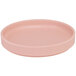A pink round plate with a low rim.