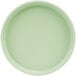 A close-up of a green Cal-Mil 6" Melamine plate with a low rim.