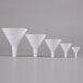 A row of five white Tablecraft plastic funnels.