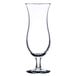 A close-up of a clear Libbey Cyclone Hurricane Glass with a stem.