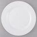 An Arcoroc Zenix glass dinner plate with a white rim.