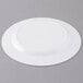 An Arcoroc white glass dinner plate with a circular rim.
