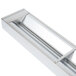 A stainless steel rectangular strip food warmer with a long handle.