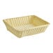 An Acopa natural woven plastic rattan basket on a white surface.