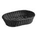 An Acopa black woven plastic rattan basket with a handle.