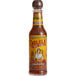 A Cholula Chipotle hot sauce bottle with a red label.