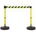 A yellow and black striped barrier with two yellow poles.