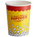 A yellow and red paper Carnival King popcorn cup filled with white popcorn.