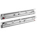 A pair of metal rails with sliding door rollers.