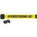 A yellow Banner Stakes tape with black text reading "Authorized Personnel Only" on a black wall mount.
