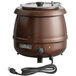 An Avantco brown copper soup kettle with a lid and a cord.