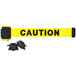 A yellow Banner Stakes "Caution" tape with black text and black and yellow magnetic ends.