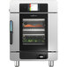 A stainless steel Alto-Shaam Converge multi-cook oven with food inside.