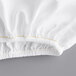 A close-up of a white Oxford Super 100% Combed Cotton fitted sheet with yellow stitching.