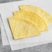 A stack of Mejor yellow unfried corn tortillas.