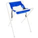 A white folding high chair with a blue seat.