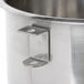 A Globe stainless steel mixing bowl with a metal bracket and handle.