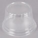 A clear plastic WNA Comet dome lid on a clear plastic cup.