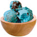 A bowl of blue G.S. Gelato Blue Monster Cookie gelato with chocolate chips.