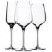 Three Stolzle Bordeaux wine glasses on a white background.