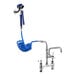 A Waterloo pet grooming faucet with blue coiled hose attached.