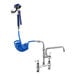 A Waterloo pet grooming faucet with blue hose and sprayer attached.