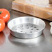 An American Metalcraft tin-plated steel deep dish pizza pan with perforations.