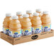 A cardboard box of Ocean Spray Pure 100% White Grapefruit Juice bottles.