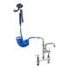 A blue Waterloo coiled hose attached to a Waterloo pet grooming faucet with a shower head.