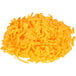 A pile of Kraft shredded sharp cheddar cheese on a white background.