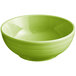 An Acopa Capri green stoneware bistro bowl with a white rim on a white surface.