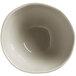 A white bowl with a small rim and a black circle with a white line on the inside.