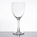 A close-up of a clear Arcoroc tall wine glass on a white background.