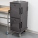 A Cambro Ultra Camcart food pan carrier in granite gray on wheels.