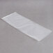 A white rectangular ARY VacMaster vacuum packaging bag on a gray surface.