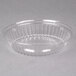 A Dart clear plastic dome lid with a ribbed rim over a clear plastic bowl.