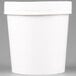 A white Huhtamaki paper food cup with a white lid.