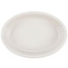 A Hall China oval baker dish in ivory with a white background.