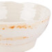 A white bowl with orange spots.