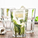 A Fortessa Basics Chez Bistro beverage glass filled with a drink and lime slices.