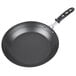A black Vollrath frying pan with a black handle.