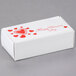 A white Valentine's Day candy box with red hearts and a Valentine's Day message.