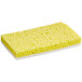 A yellow Lavex sponge with white scouring pad.