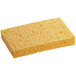 A yellow rectangular Lavex cellulose sponge with holes.