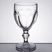 A close-up of a Libbey Gibraltar clear glass goblet with a stem.