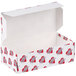 A white 1/2 lb. heart candy box with red hearts on it.