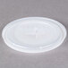 A translucent plastic Cambro lid with a straw slot.