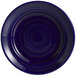 A cobalt blue Tuxton Concentrix china plate with a spiral pattern on it.