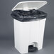 A white Continental rectangular step-on trash can with a black liner.