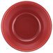 A red melamine bowl with a lid on a white background.